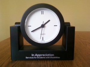 Black Desk clock reading In Appreciation Services for Students with Disabiliites