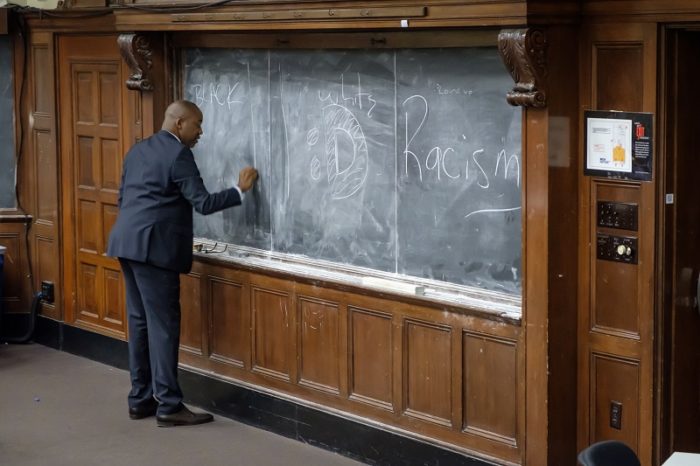 Image of Dr. Moore at chalkboard