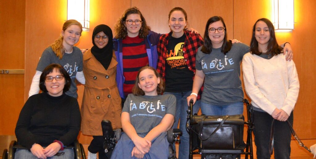 Group photo of students smiling at disability event