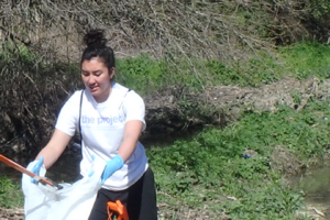 Volunteers picking up trash for The Project