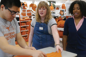 Co-op interns working on t-shirt sales